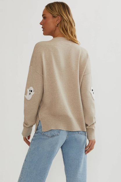 Back view of the beige jumper showing a plain back, ribbed hem with side slits and ghost elbow patches 5