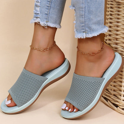 Slides in grey knit with a pale blue sole, worn with frayed jeans and gold anklets 3