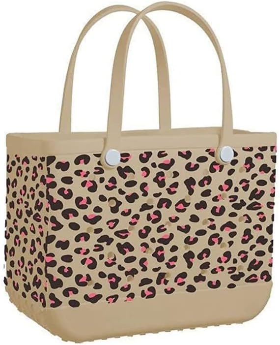 Tan tote printed with a leopard spot pattern in brown and pink, with a plain tan base and upright handles. 19