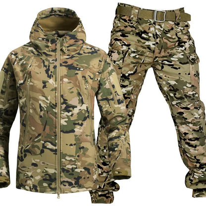 Desert camouflage hooded jacket and matching cargo trousers with belt shown together against a white background, in a green, tan and black pattern. 20