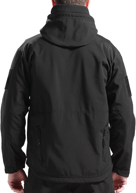 Back view of the black hooded jacket on a model, showing the stitched back panel, elbow patches and lower zip pockets. 3