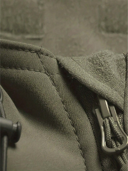 Close-up of the olive green jacket's collar, with seam stitching, fleece-lined hood edge, drawcord toggle and zip pull. 7