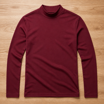 Burgundy version of the long sleeve high-neck tee laid flat on a wooden floor. 11